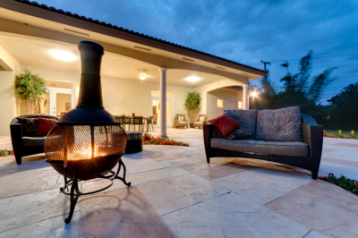 a modern fire pit in a stone patio