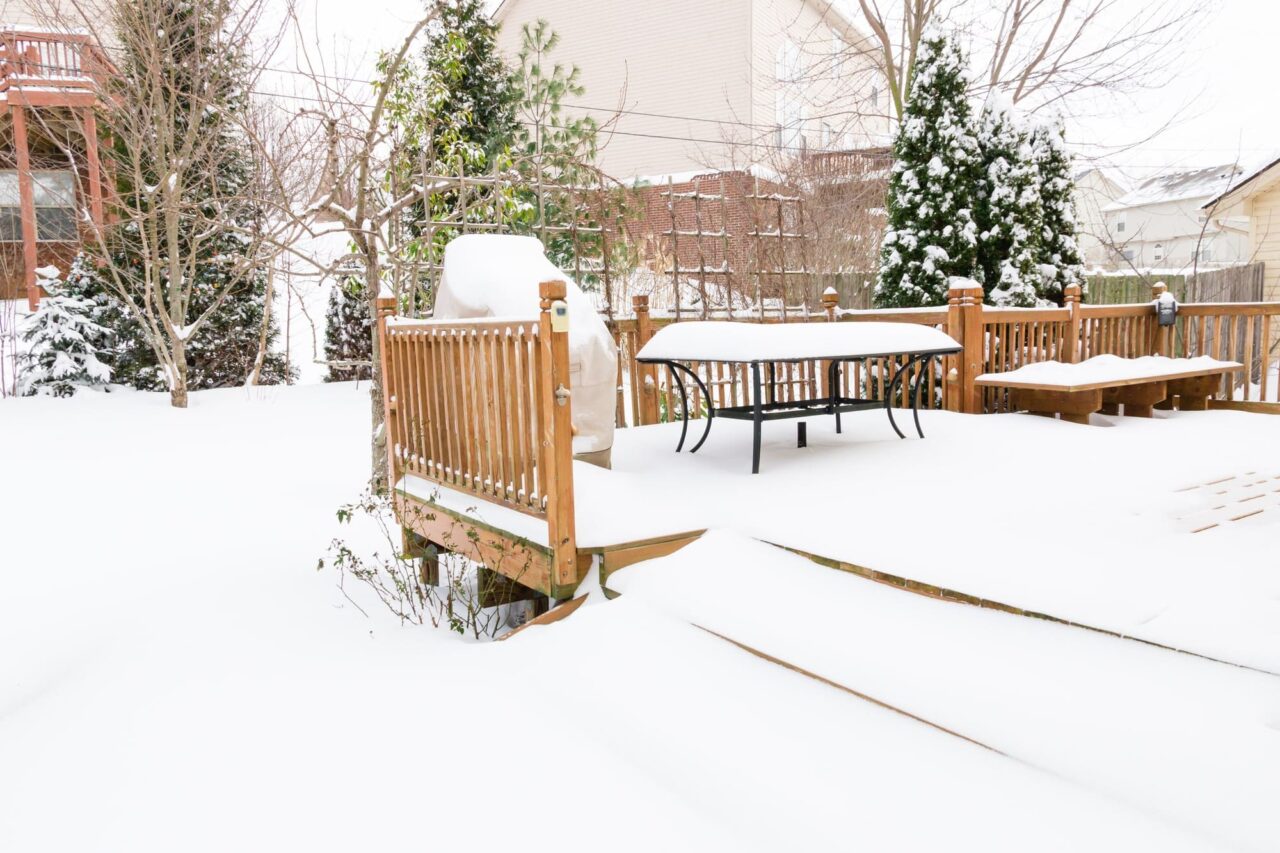 Photo of snow-covered deck and patio