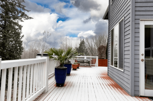 photo of a deck with a light dusting of snow