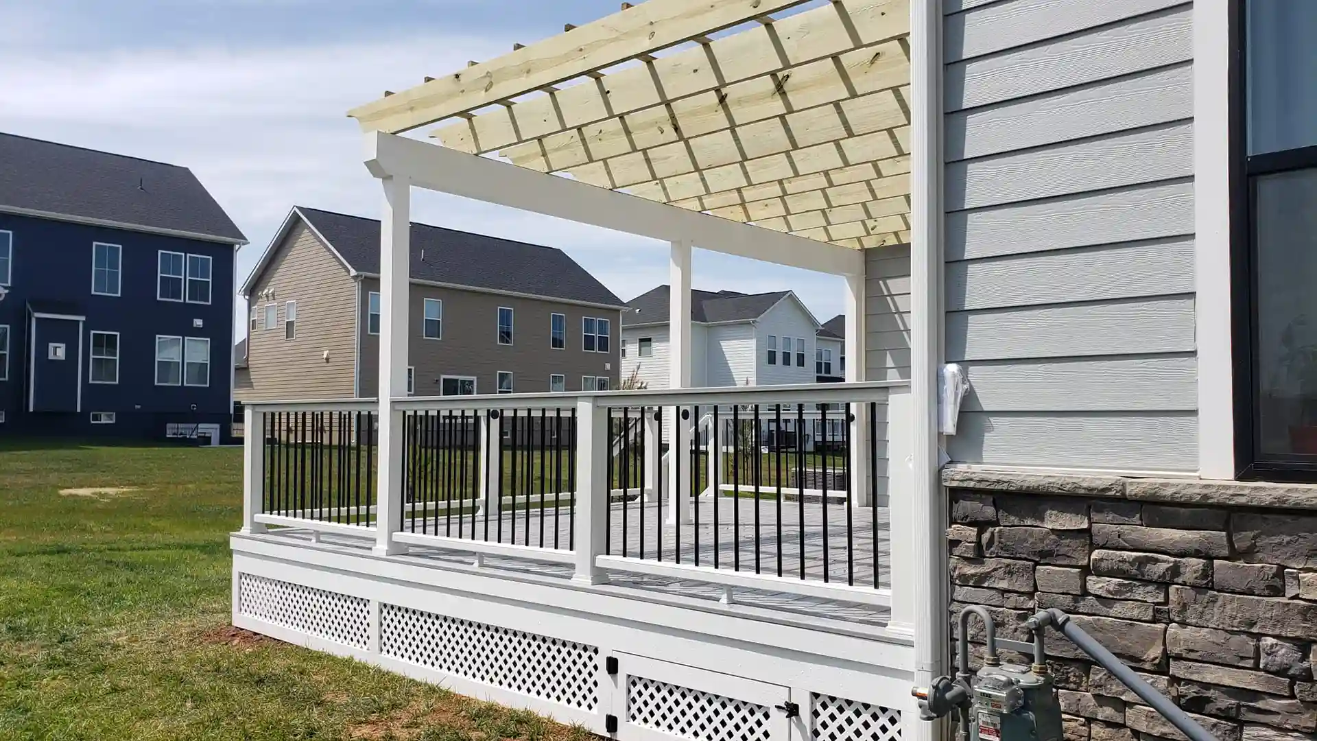 photo of deck with traditional wooden pergola