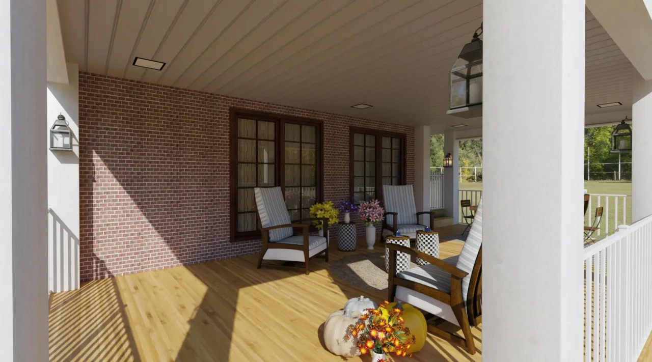 A covered wraparound porch with wooden floors and white pillars. The back wall of the porch is made of red brick and has two sets of double doors with dark frames. There are several pieces of outdoor furniture, including rocking chairs with striped cushions and a small table with flowers.