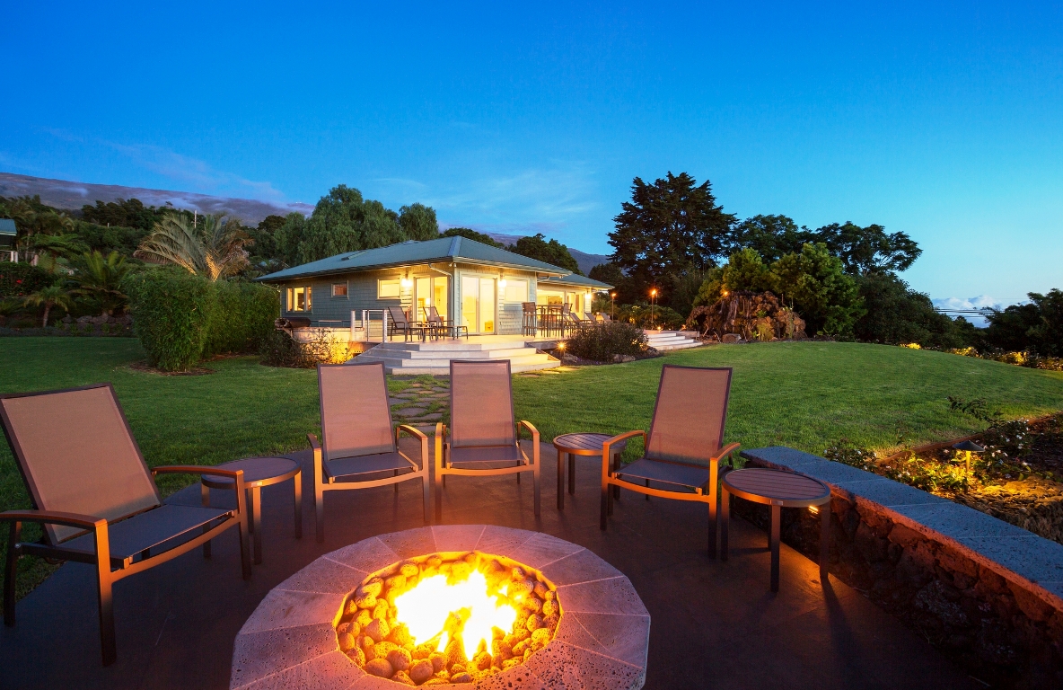 A cozy gas fire pit with seating around it, perfect for gathering and enjoying an evening under the stars.