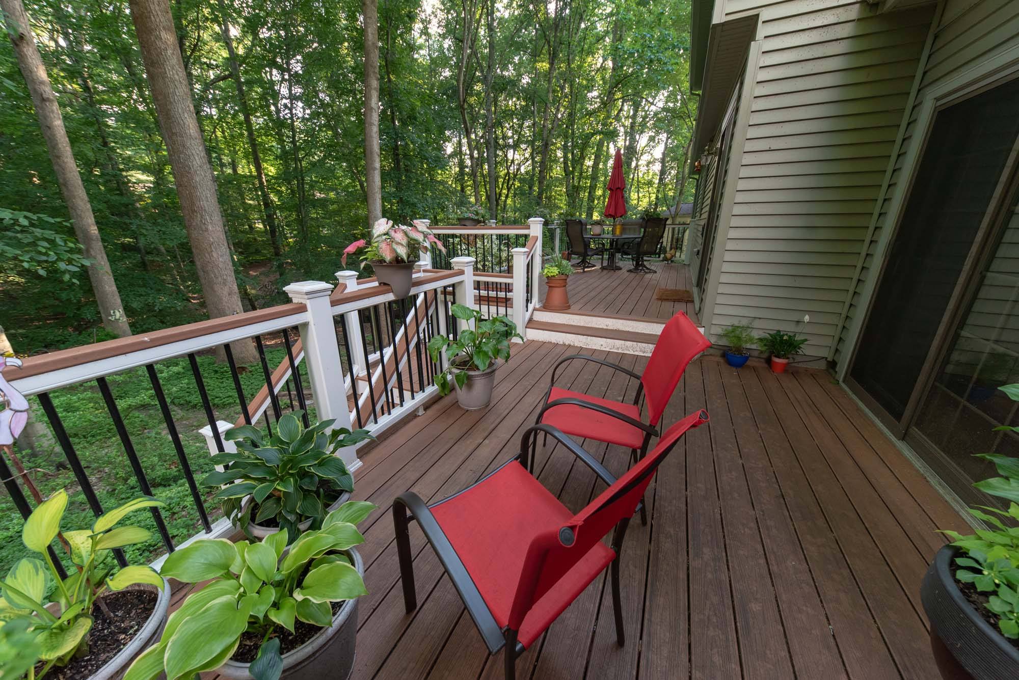 Composite deck with red lawn chairs