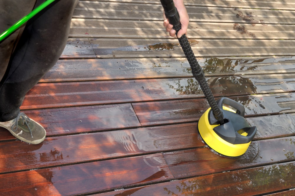 Scrub the deck and use a pressure wash to rinse off
