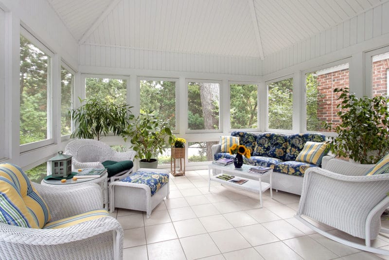 How to winterize a screened-in porch with couch and white tile floor image